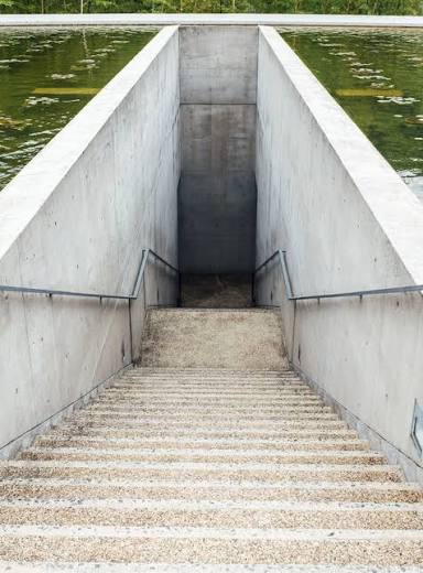 Water Temple by Tadao Ando, [lotus pond exterior / concrete wing walls / descent staircase / vermilion sanctuary interior / light court / Awaji Island hillside context], 1991 Japan