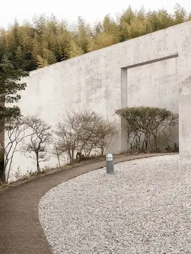 Water Temple by Tadao Ando, [lotus pond exterior / concrete wing walls / descent staircase / vermilion sanctuary interior / light court / Awaji Island hillside context], 1991 Japan