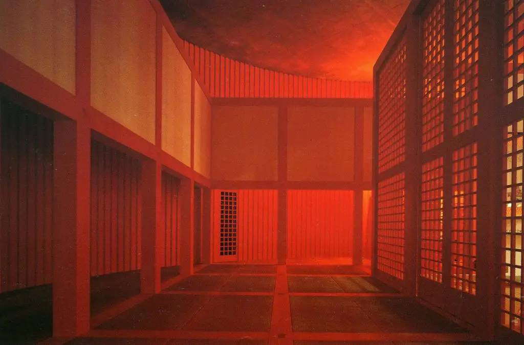 Water Temple by Tadao Ando, [lotus pond exterior / concrete wing walls / descent staircase / vermilion sanctuary interior / light court / Awaji Island hillside context], 1991 Japan