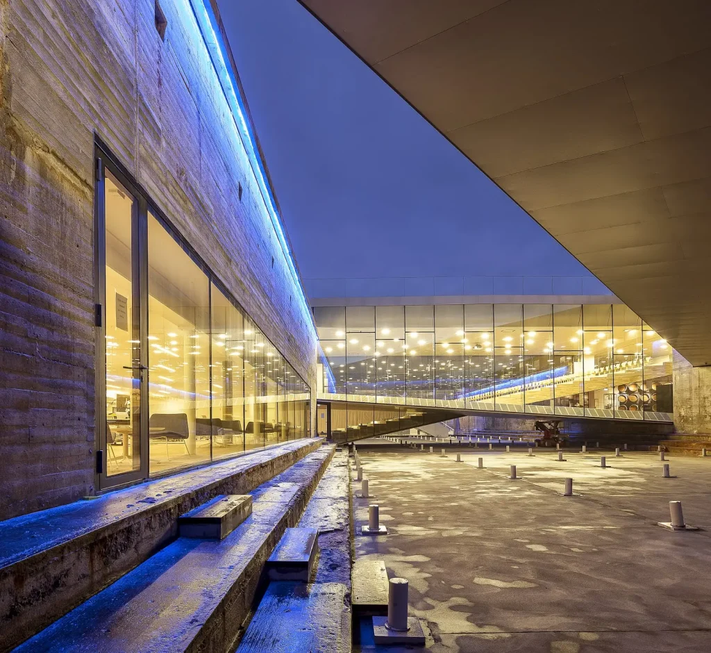Danish National Maritime Museum by BIG Bjarke Ingels Group,
[aerial dry dock view / bridge spanning dock / underground gallery /
Kronborg Castle context / entrance zig-zag bridge / Morse code bollards /
auditorium bridge / dock interior], Helsingør Denmark 2013