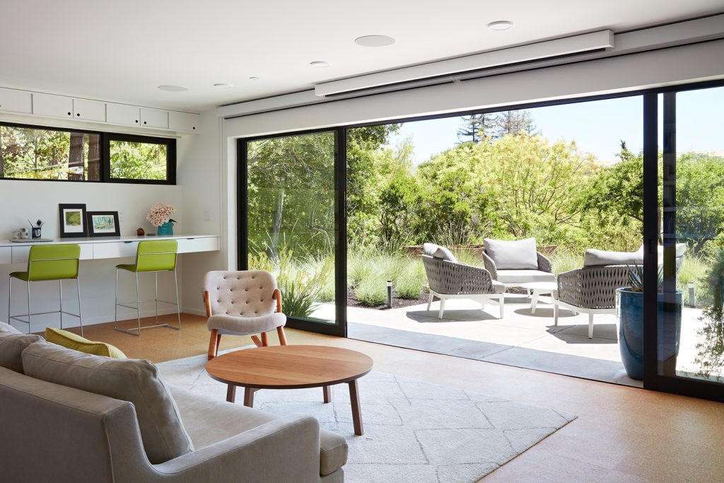 Mid-century modern remodel of Roger Lee 1962 Stanford house by Klopf Architecture,
[exterior redwood facade / corner office hill views / outdoor living room pergola /
living room glass sliders / lower level family room patio / kitchen outdoor dining /
Malm fireplace Heath tiles / primary bedroom window glazing], Stanford California 2020