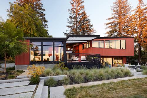 Mid-century modern remodel of Roger Lee 1962 Stanford house by Klopf Architecture, [exterior redwood facade / corner office hill views / outdoor living room pergola / living room glass sliders / lower level family room patio / kitchen outdoor dining / Malm fireplace Heath tiles / primary bedroom window glazing], Stanford California 2020