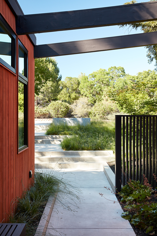 Mid-century modern remodel of Roger Lee 1962 Stanford house by Klopf Architecture,
[exterior redwood facade / corner office hill views / outdoor living room pergola /
living room glass sliders / lower level family room patio / kitchen outdoor dining /
Malm fireplace Heath tiles / primary bedroom window glazing], Stanford California 2020