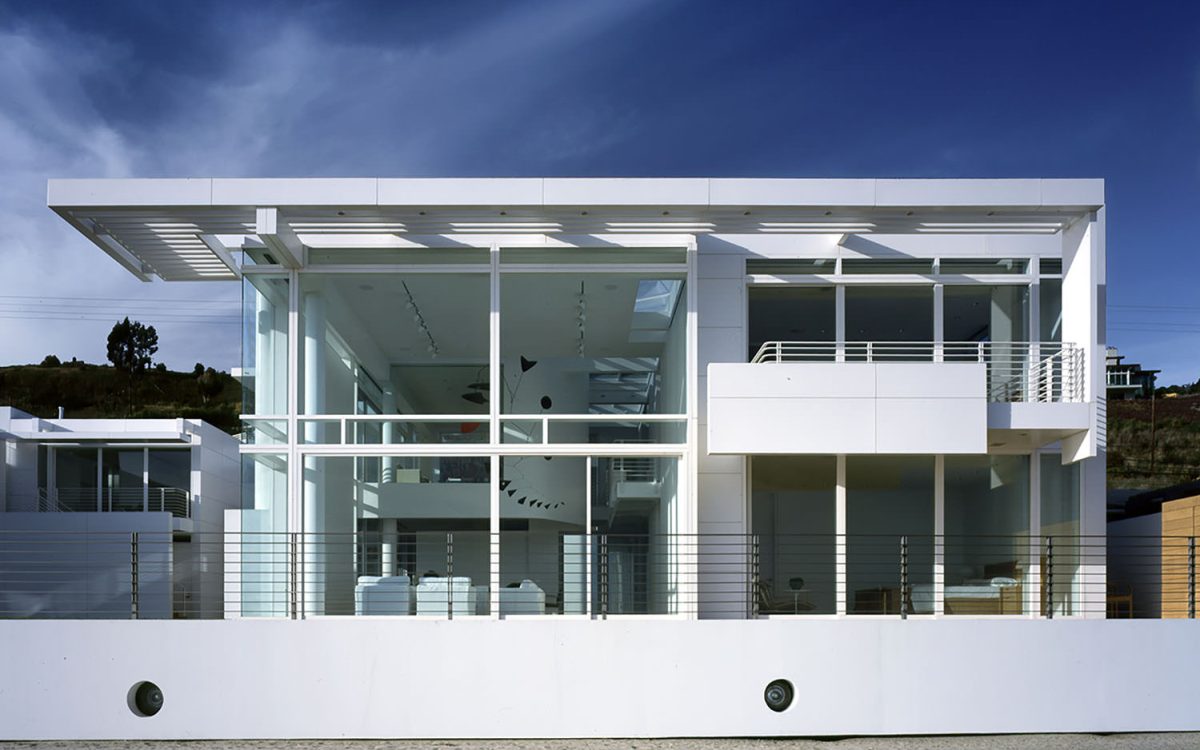 Southern California Beach House by Richard Meier and Michael Palladino, [exterior courtyard / glazed bridge / double-height living room / ocean facade / sunscreen louver detail / entry wall], Malibu California 2001